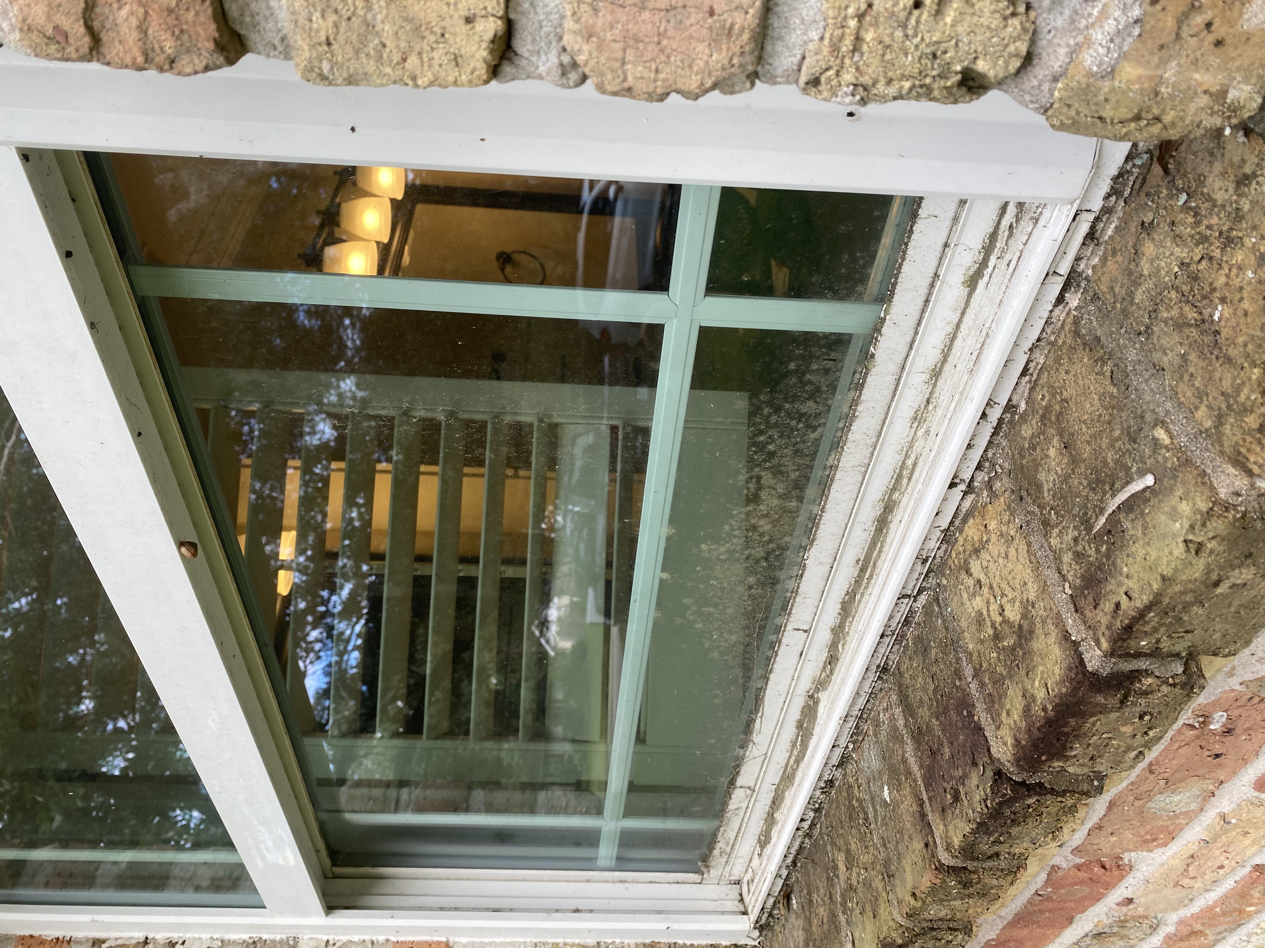 Dirty brick house window before