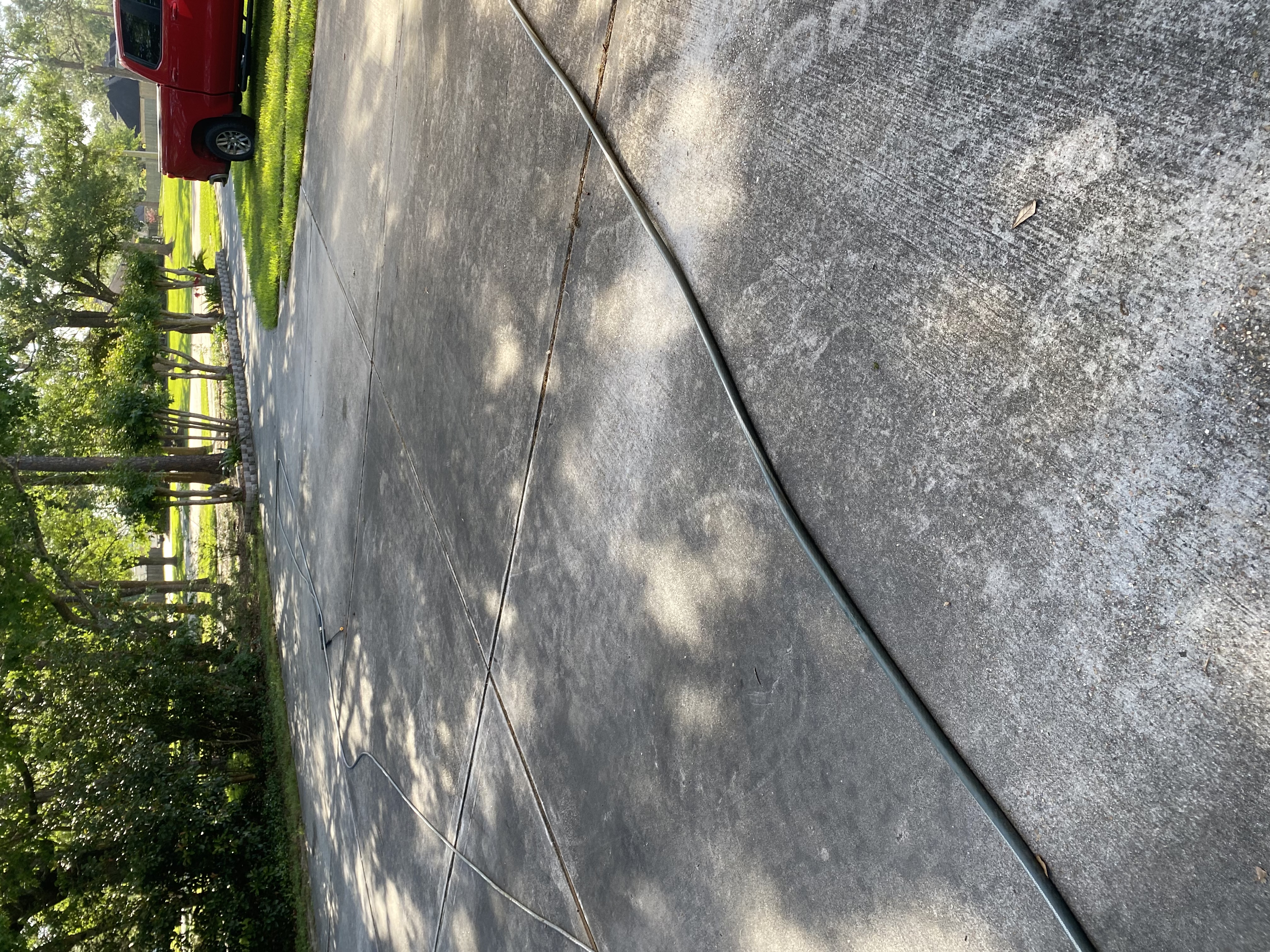 Dirty wooded home driveway before